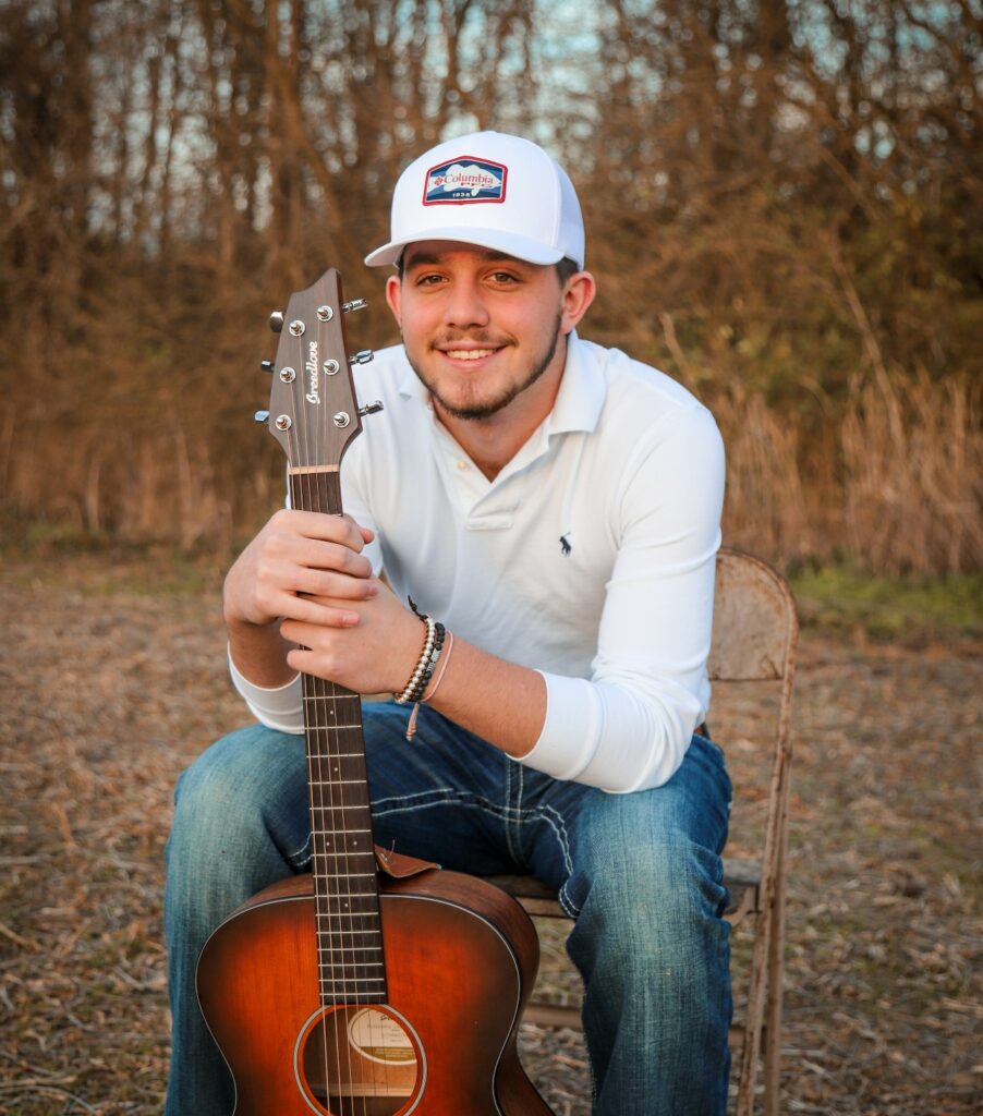 Avery with guitar